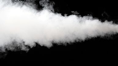 Picture of fog coming out of a fog cannon (not pictured) on a black background