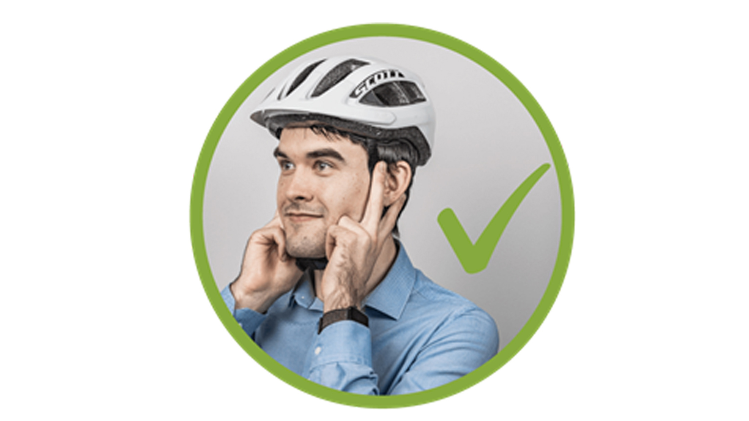 A man indicates how the helmet should fit by placing two fingers under each ear.